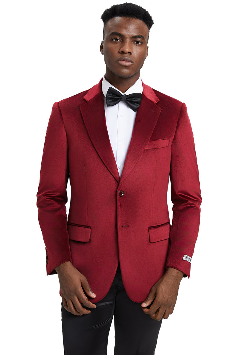 Burgundy velvet blazer with a modern fit. Features single-button closure, notched lapels, and two front pockets. Subtle sheen and fitted silhouette with visible interior stitching.
