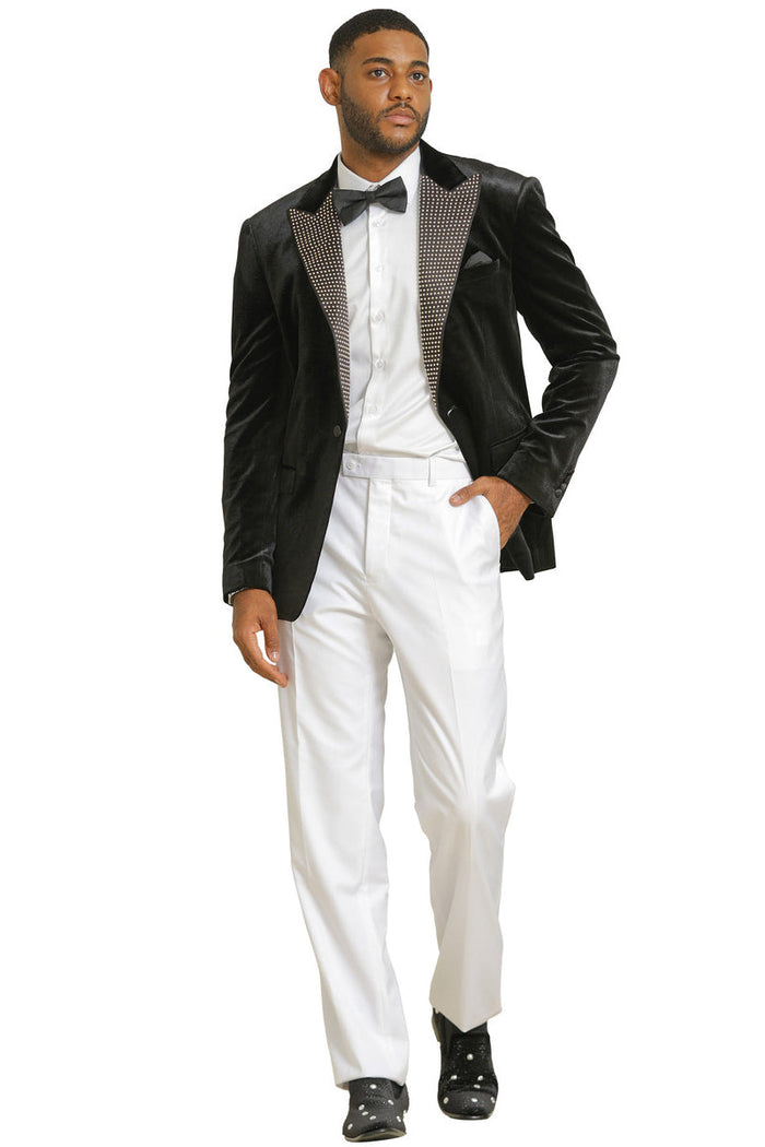 Black velvet men's tuxedo jacket. Features rhinestone-studded lapel, single-button closure, tailored fit, and peak lapels. Luxurious, smooth texture.
