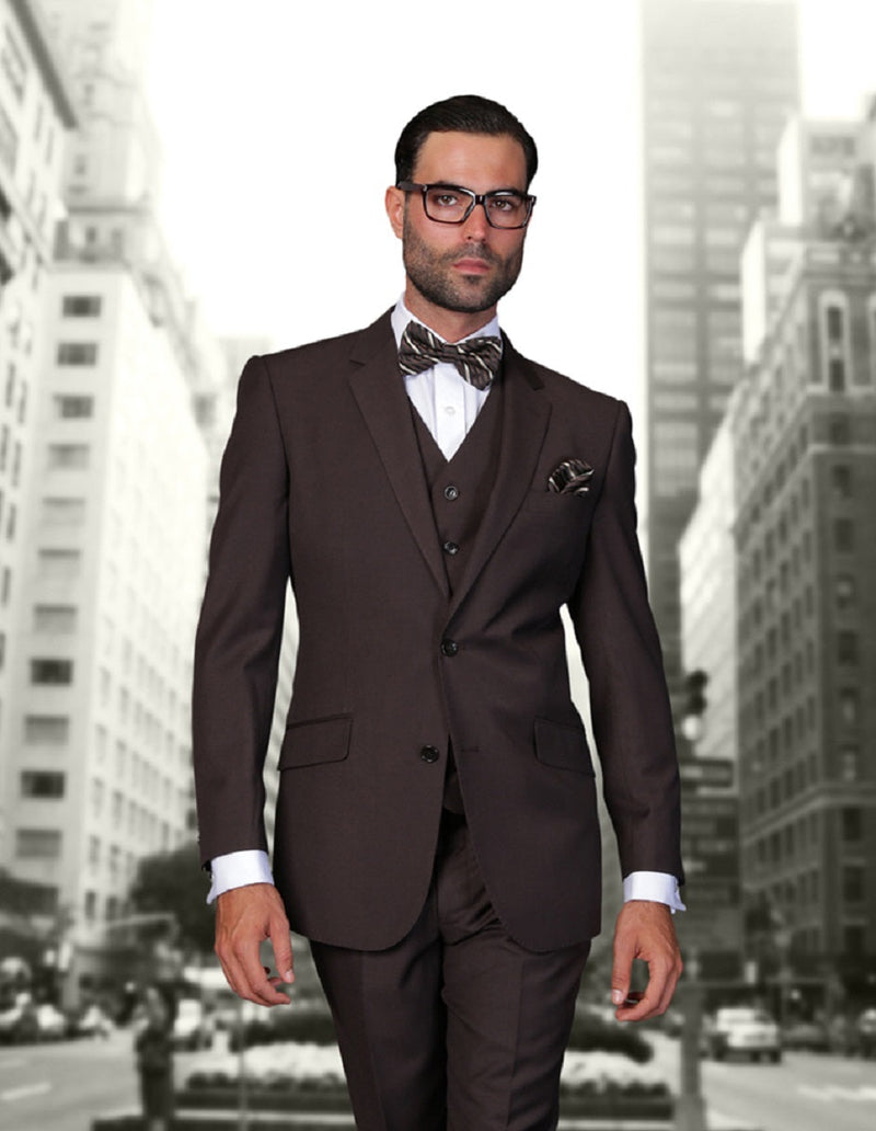 Men's brown modern fit wool suit with a 2-button closure. Includes a matching vest and notched lapels. Paired with a light blue shirt & bow tie.