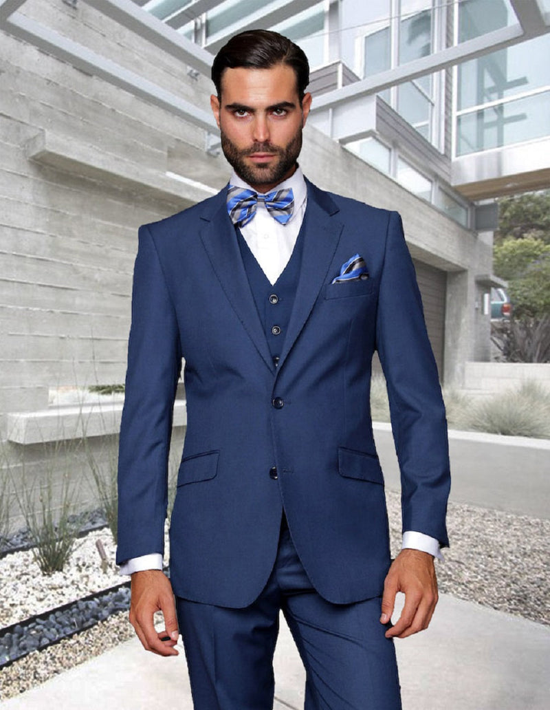 Indigo blue men's modern fit wool suit with vest. Features a 2-button closure and tailored, fitted design. Classic wool texture for a refined look.