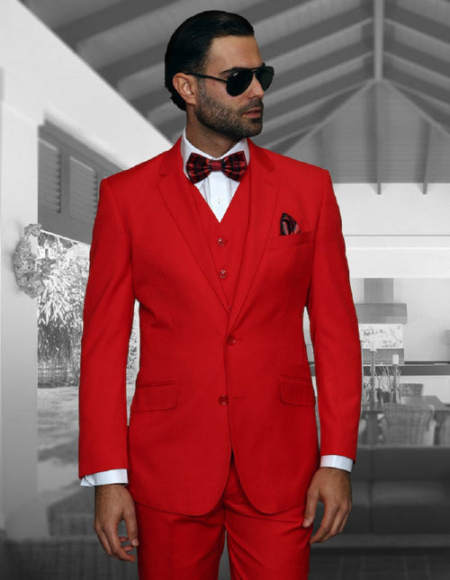 Modern fit red wool suit for men, featuring a 2-button closure, notch lapels, and side pockets. Includes a matching vest. Tailored silhouette, solid red color.