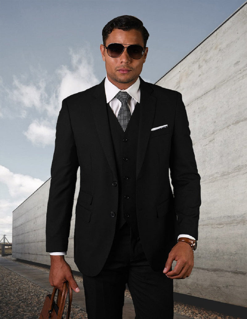 Men's modern fit, black 2-button suit with matching vest. Features pick-stitching, sharp lapels, and subtle sheen. Includes a white shirt & patterned tie for a sleek, contemporary silhouette.