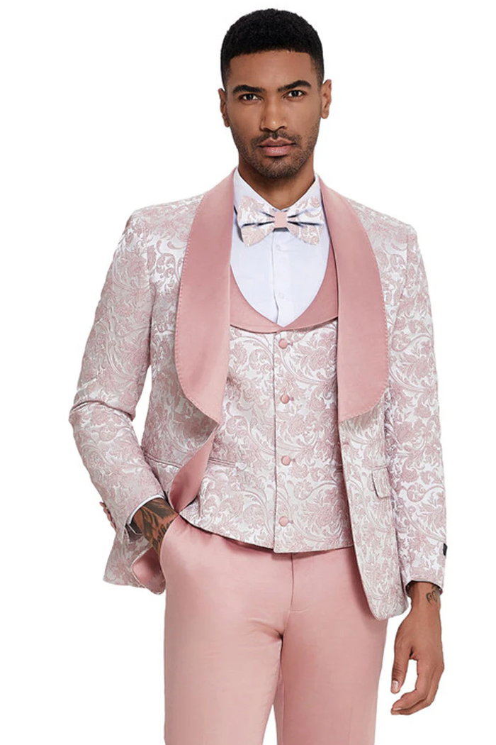 Men's light pink tuxedo with paisley shawl lapel. Includes matching vested shirt and pants. Perfect for formal events.

