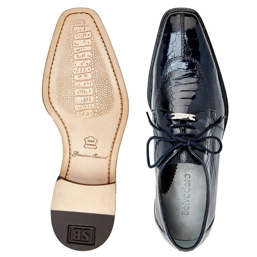 Men's Belvedere Chapo dress shoe. Black hornback caiman crocodile skin with pointed toe and glossy texture. Black laces, low stacked heel. Tan leather sole with embossed pattern.

