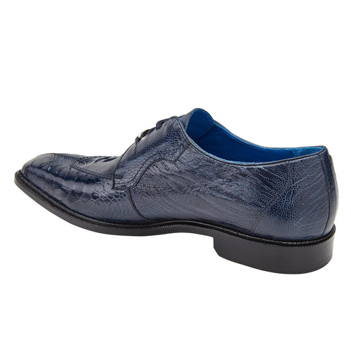Navy men's Belvedere Siena moc toe dress shoe. Crafted from exotic navy ostrich leg leather with a sleek, elongated shape and rounded toe. Features a contrasting black outsole and blue interior lining.
