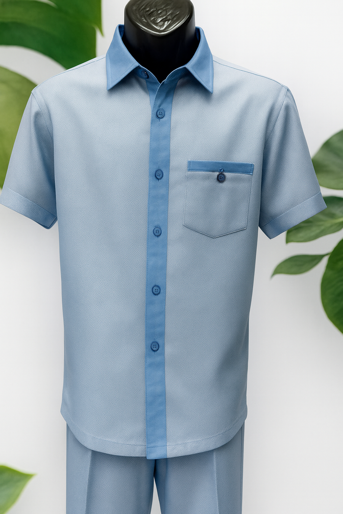 Sky blue men's walking suit with off-white houndstooth accents. Short sleeve shirt with pointed collar, chest pocket, and dark blue buttons. Smooth, structured fabric for a tailored look.
