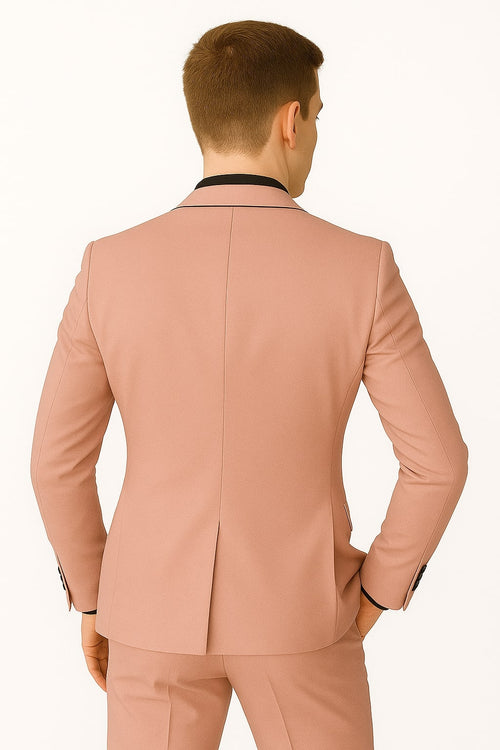 Men's slim-fit pink tuxedo with black trim. Features a structured jacket, single back vent. Stylish formal wear.

