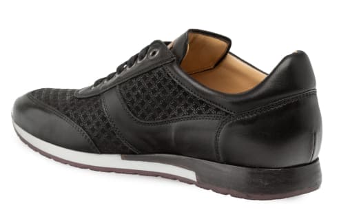 Mezlan black calfskin & suede dress sneaker. Rounded toe, low-top. Combines smooth calfskin & textured suede. Lace-up, tonal eyelets. White midsole. Dark outsole with slight tread.
