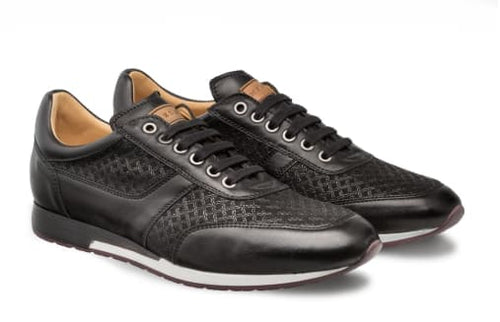 Mezlan Maxim dress sneaker: Black calfskin & suede, low-profile. Textured upper with central lacing. White sole elevates heel slightly. Smooth, rounded toe.
