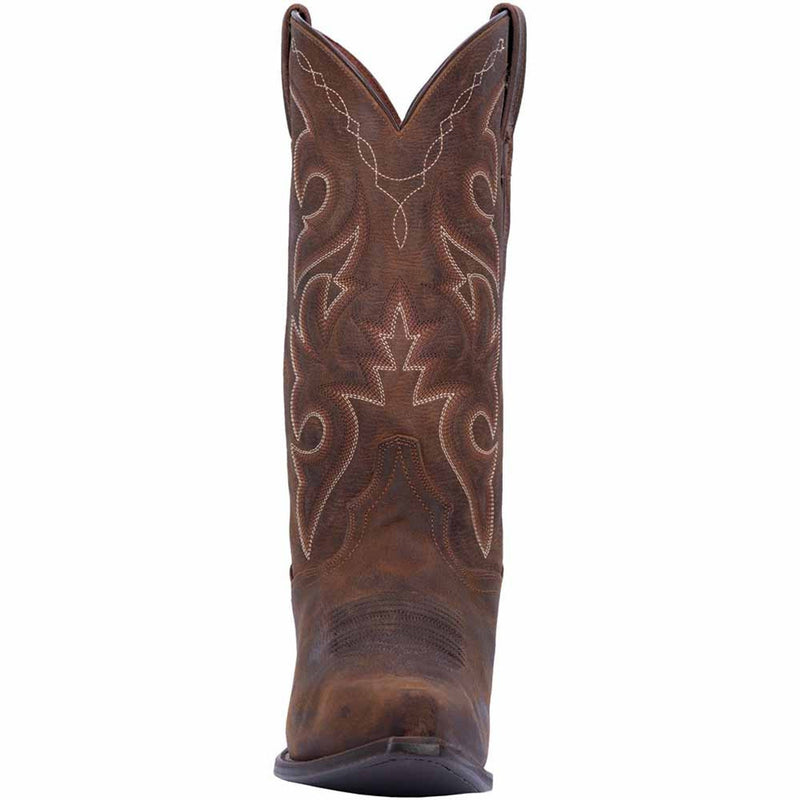 Dan Post Renegade Bay Apache cowboy boots: Distressed brown leather with a snip toe and contrasting stitching. Features intricate floral designs, a tall shaft, and a sturdy sole with a slight heel for stability.

