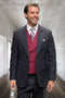 Men's black glenplaid wool suit with a tailored fit. Includes a double-breasted burgundy vest and contrasting white shirt. Features textured fabric, checkered pattern, and front pockets, ideal for formal events.
