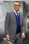 Men's designer wool suit. Grey glenplaid pattern. Tailored jacket with notch lapels, fitted vest, and matching trousers. Dark grey shades with blue interior accents. Structured, formal appearance.
