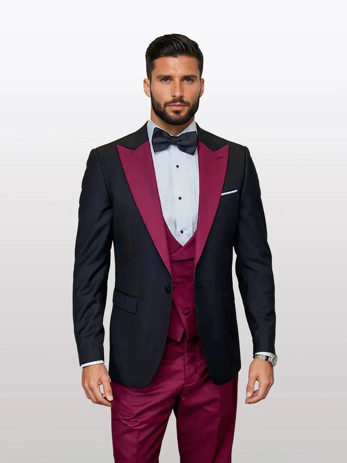 Black vested tuxedo made from 100% wool, featuring a burgundy peak lapel. The tuxedo includes a matching burgundy vest and tailored fit.
