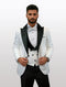 Men's tuxedo featuring a white jacket with black peak lapels, a black vest, and a white shirt with a checkered pattern. It includes a matching bow tie and black trousers.