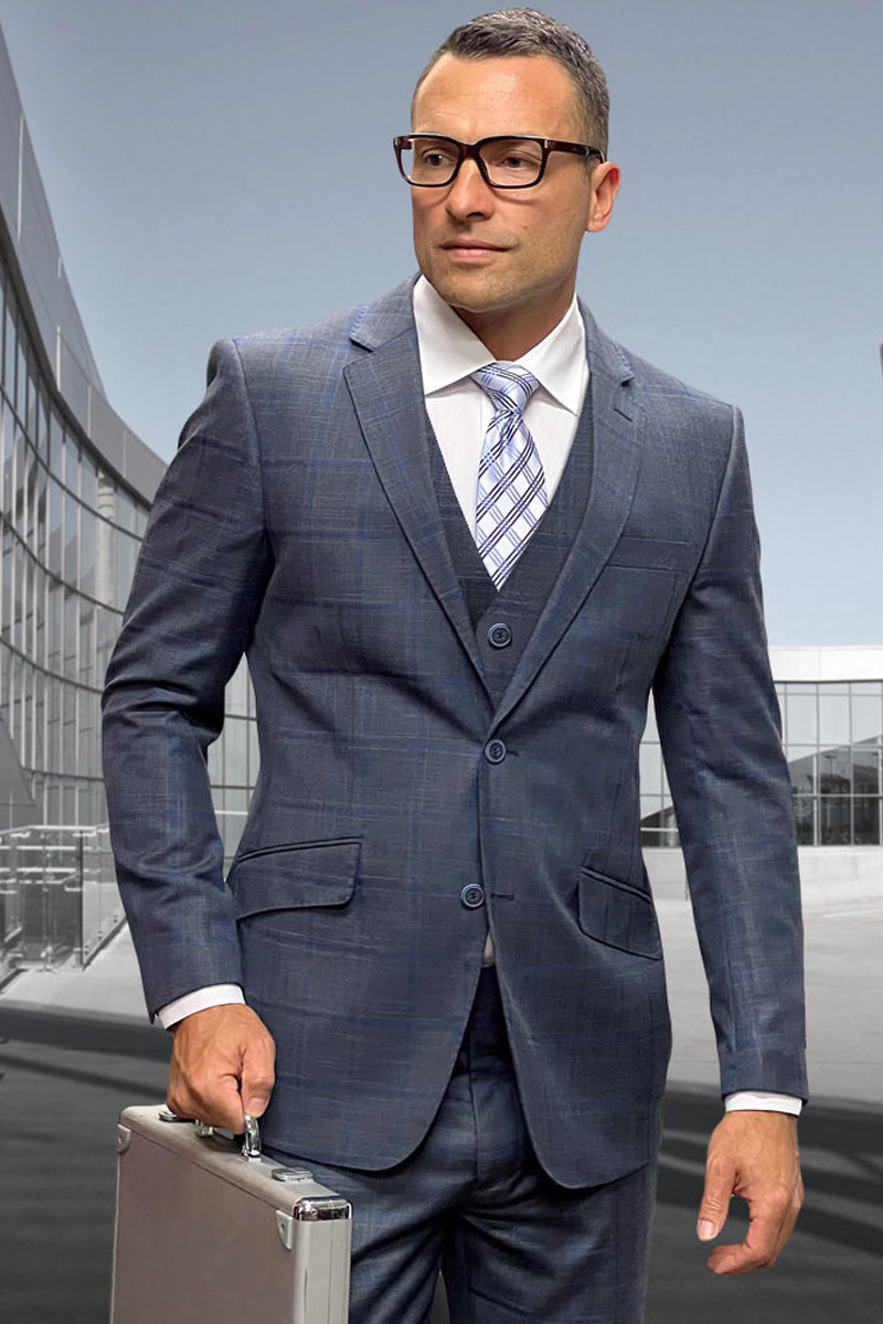 Charcoal grey men's designer suit with windowpane pattern. Tailored two-button jacket, fitted vest, and matching trousers. Fine wool blend for a structured, cohesive look.
