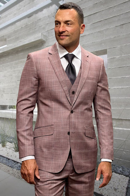 Mauve pink wool suit with windowpane pattern. Two-button jacket, vest, and matching trousers. Fitted jacket with front pockets. Tailored design.

