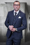 Men's modern fit charcoal grey wool suit with glen plaid. Includes fitted jacket, trousers, and vest for a tailored look. Textured fabric, notch lapels, and button details add sophistication.
