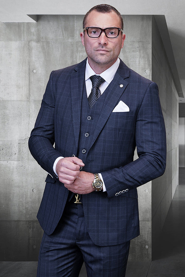 Men's modern fit charcoal grey wool suit with glen plaid. Includes fitted jacket, trousers, and vest for a tailored look. Textured fabric, notch lapels, and button details add sophistication.
