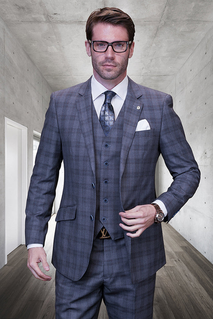 Modern fit men's grey glen plaid wool suit. Three-piece design: tailored jacket, vest, & pants. Classic check pattern. Structured silhouette with notched lapel & button closures. Refined appearance.
