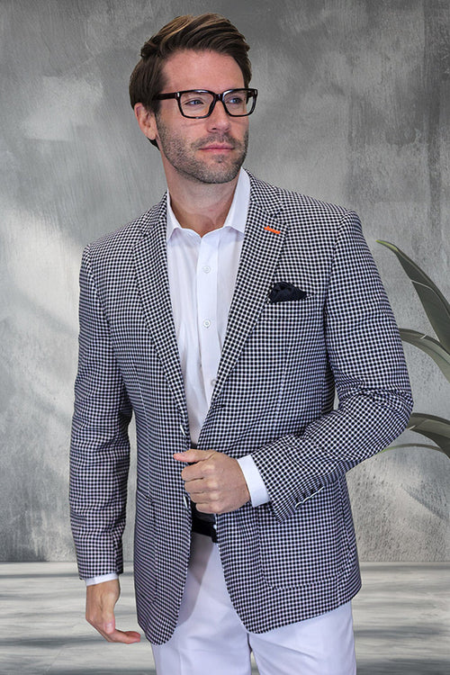 Men's modern fit black windowpane wool blazer. Structured silhouette, textured wool. Patch pocket, notched lapels. Classic design meets contemporary style, tailored sleeves, casual fit. Ideal for summer wear over a white shirt.
