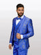 Mens royal blue patterned vested tuxedo featuring a bowtie by Alberto Nardoni; the tuxedo displays intricate gold floral patterns, with a sleek fit and satin finish.