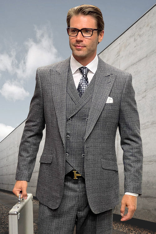 Men's wool suit: muted black windowpane plaid. Peak lapel jacket, fitted silhouette. Includes vest and matching tailored trousers. Crafted from wool.
