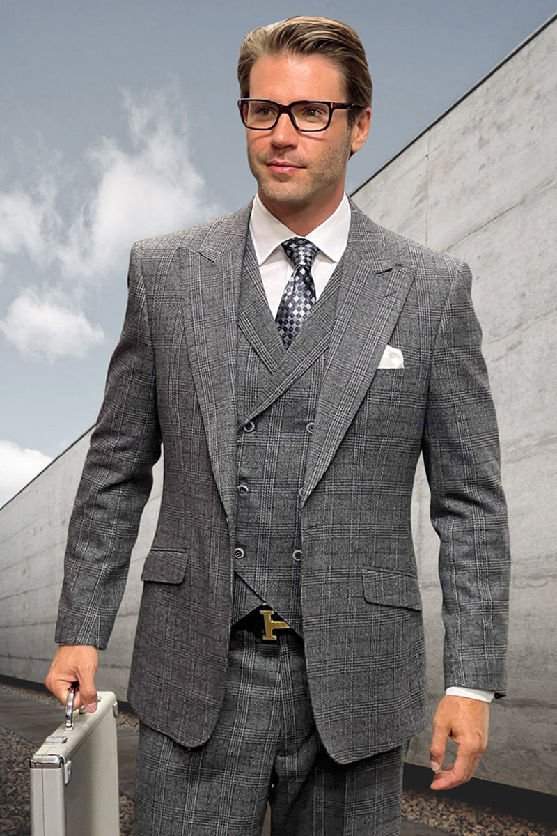 Men's wool suit: muted black windowpane plaid. Peak lapel jacket, fitted silhouette. Includes vest and matching tailored trousers. Crafted from wool.
