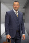 Navy wool suit with windowpane plaid. Double-breasted jacket, peak lapels. Matching trousers. Classic designer style.
