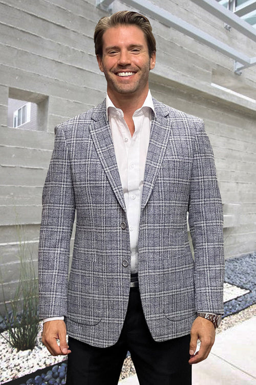 Modern fit men's sport coat in grey windowpane wool-cashmere blend. Features notched lapels, two-button closure, and patch pockets for a tailored, textured look.
