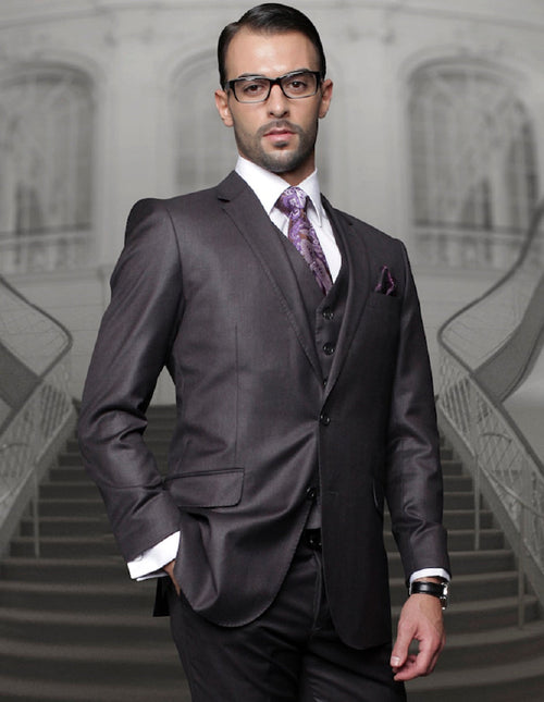 Men's charcoal grey wool suit with a classic fit. Features a 2-button blazer with notched lapel and pleated trousers. Structured silhouette with a smooth fabric texture.