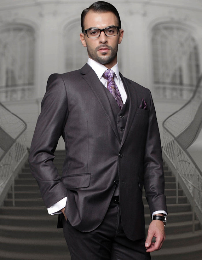 Men's charcoal grey wool suit with a classic fit. Features a 2-button blazer with notched lapel and pleated trousers. Structured silhouette with a smooth fabric texture.
