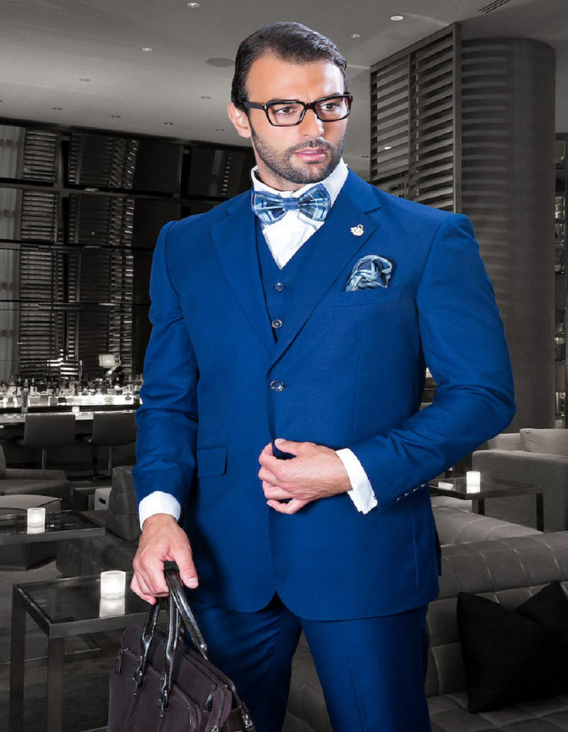Men's classic fit sapphire blue wool blend suit. Two-button jacket with a fitted silhouette, and pleated pants. Perfect for formal occasions.
