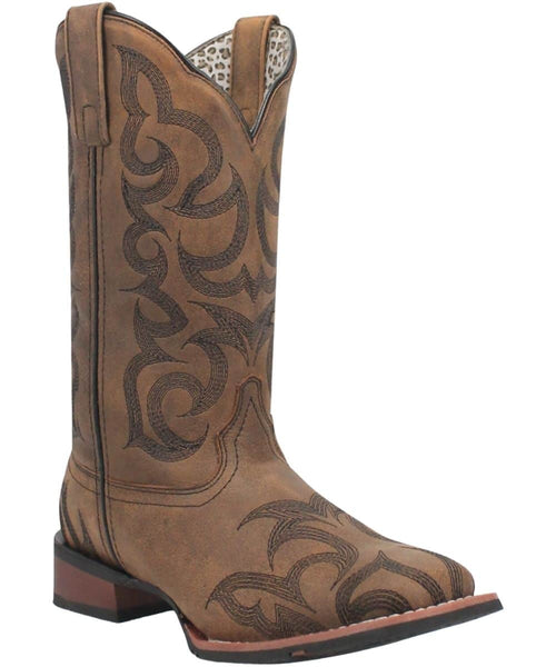 Laredo Women's Sariah boot: Tall shaft, pointed toe, tan leather-like upper with swirl stitching. Stacked heel, reinforced toe, brown outsole. Scalloped top, light patterned lining.
