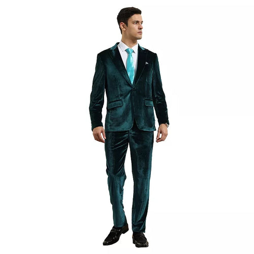 Men's teal velvet suit set. Two-piece with peak lapel, soft textured fabric. Jacket: unbuttoned, two pockets. Pants: tapered, matching color for a cohesive, stylish look.
