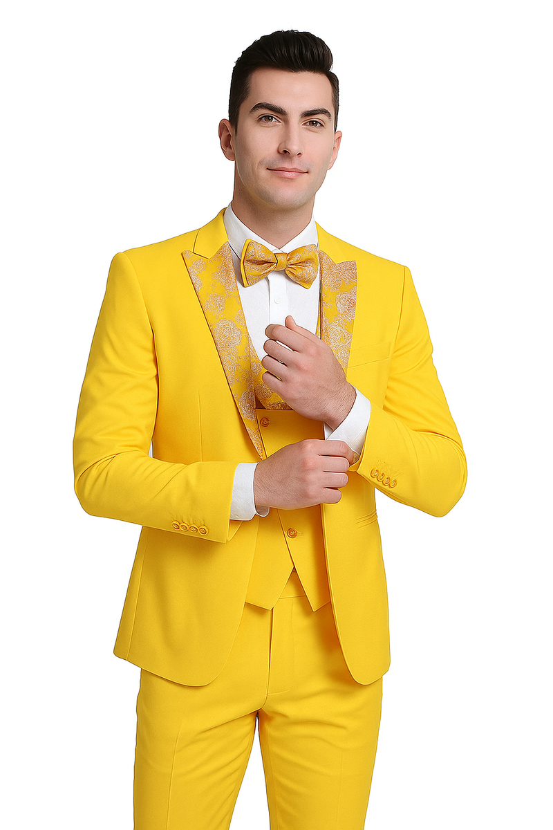 Vivid yellow men's three-piece suit with floral peak lapel and matching bow tie. Includes jacket, waistcoat, and tailored trousers. Smooth, slightly shiny material. Structured shoulders & front-fastening waistcoat.
