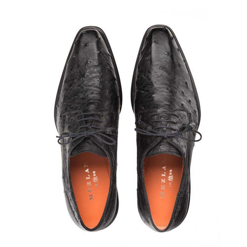 Mezlan's Tillson bluchers: black ostrich leather, elongated silhouette, plain toe. Features unique texture, traditional laces. Orange interior lining visible. Sleek and stylish design.
