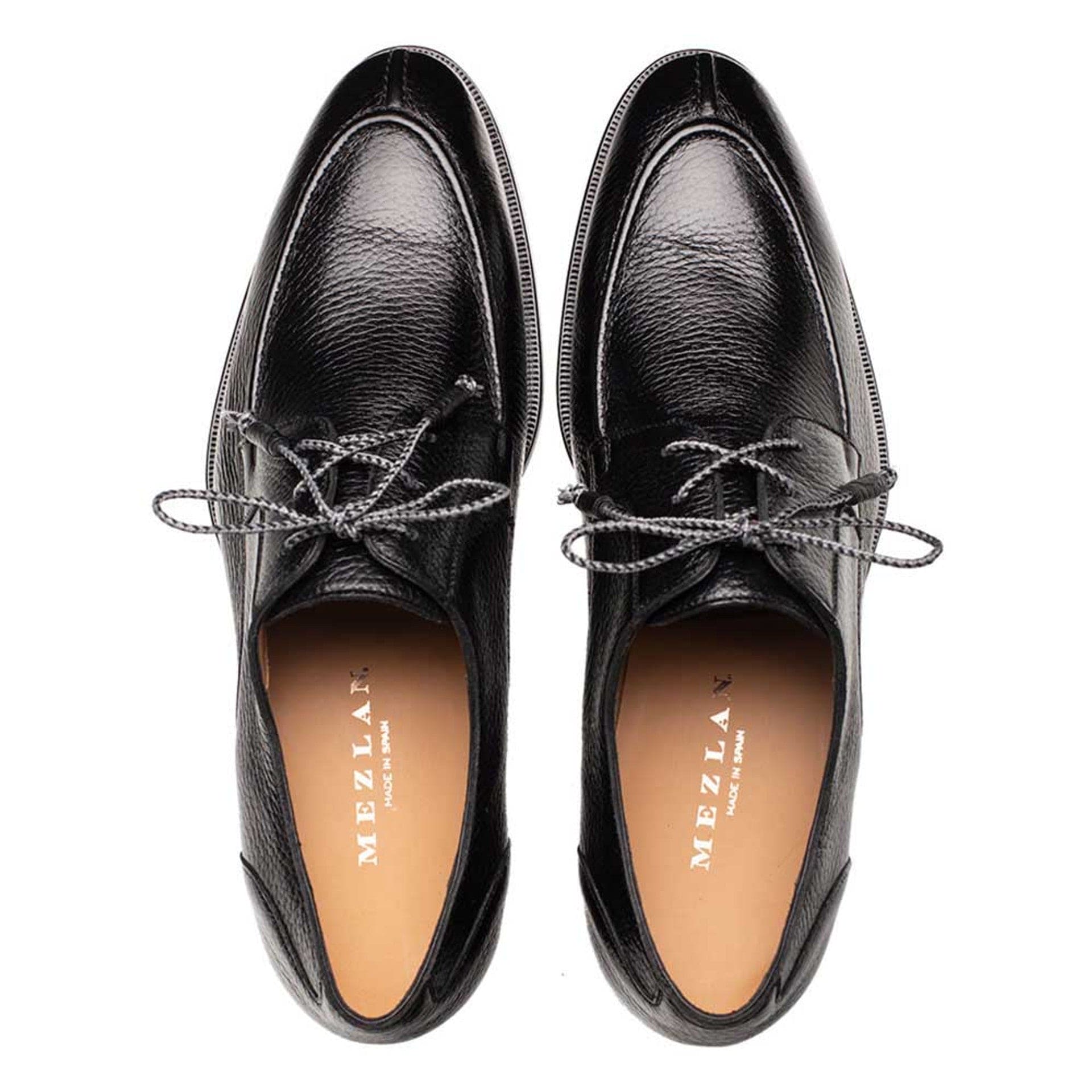 Mezlan Fratello black deerskin split toe shoes. Smooth black leather upper with textured finish, contrasting laces, and round toe. Tan lining. Durable outsole. Classic lace-up style.
