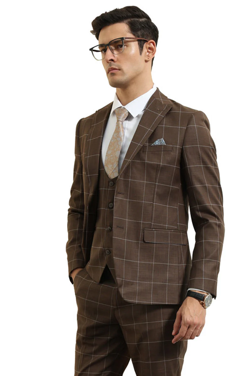 Slim-fit men's suit in brown windowpane plaid. Features a structured, fitted silhouette with a peak lapel jacket, vest, and two front pockets. Textured fabric.
