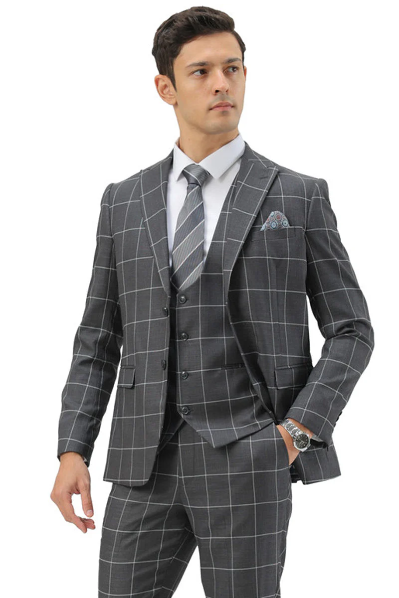 Men's slim fit grey windowpane suit: two-button peak lapel, vested, structured silhouette. Matching vest and tailored trousers. Contrasting white grid pattern on grey base for a cohesive plaid design.
