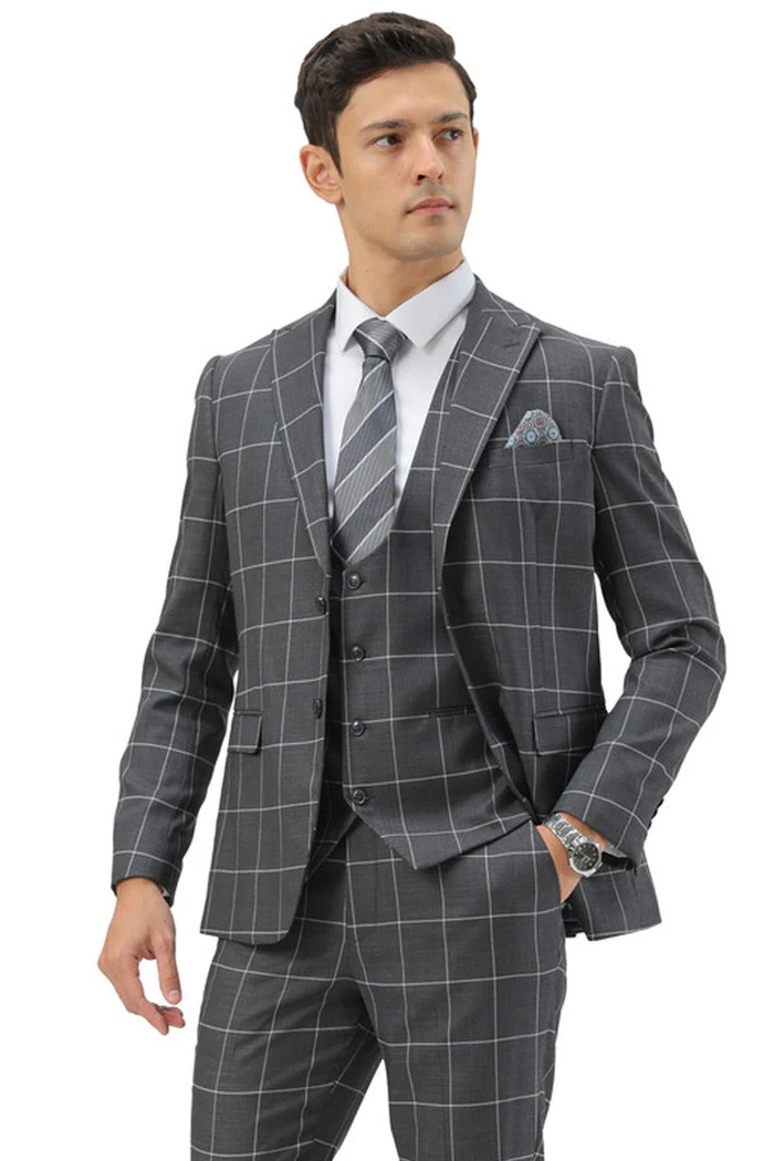 Men's slim fit grey windowpane suit: two-button peak lapel, vested, structured silhouette. Matching vest and tailored trousers. Contrasting white grid pattern on grey base for a cohesive plaid design.
