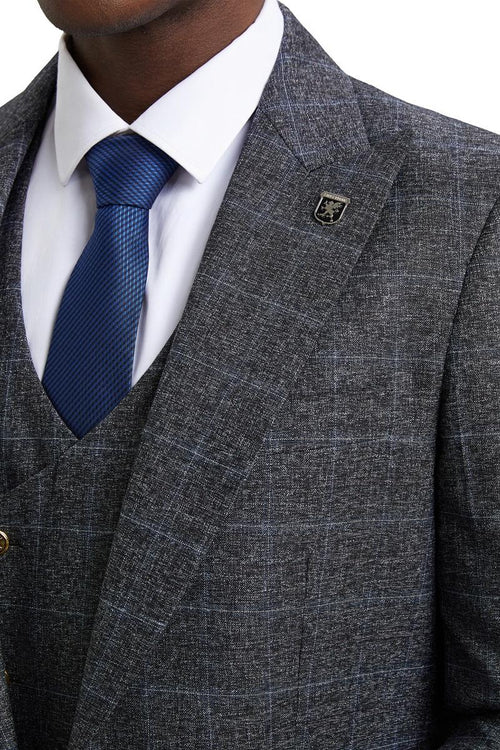 Charcoal grey Stacy Adams suit with windowpane plaid. Includes a double-breasted vest and a textured, woven-look fabric. Features a silver lapel emblem.
