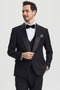 Stacy Adams black one-button tuxedo with shawl lapel. Fitted, tailored design with sharp shoulders. Features a vest, satin lapel, and patterned pocket square for a streamlined formal look.
