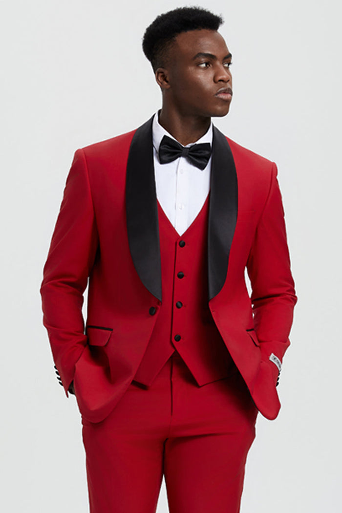Stacy Adams red one-button tuxedo with shawl lapel and five-button vest. Includes matching pants. Features a smooth finish and contrasting black lapel detail for a formal look.
