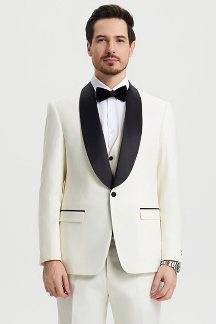 Ivory Stacy Adams men's tuxedo with black shawl lapel and trim. Single-button closure, structured fit. Includes matching ivory vest and trousers.
