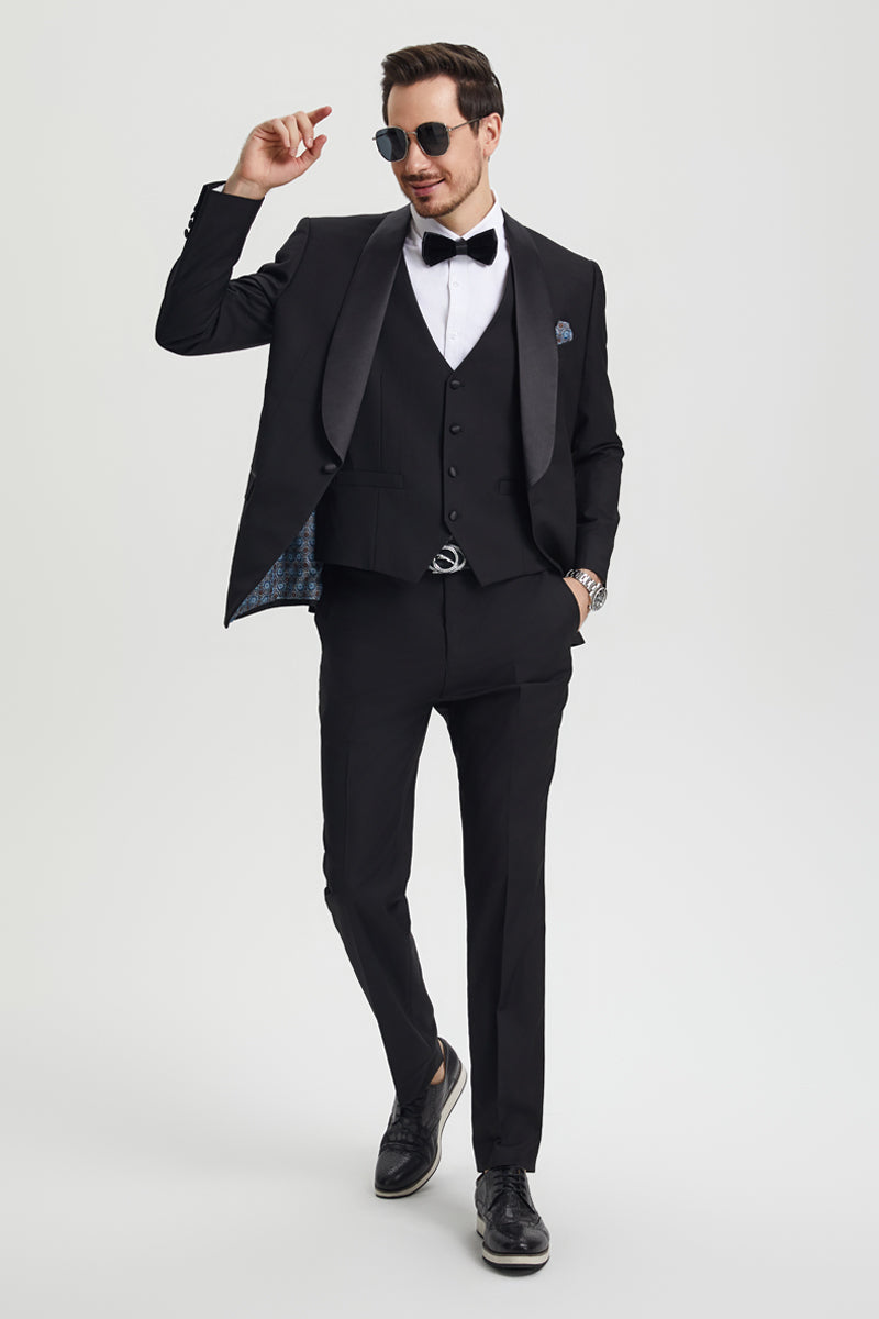 Stacy Adams men's one-button tuxedo: black, fitted jacket with satin shawl lapel, matching vest, and tailored trousers. Jacket has patterned lining.

