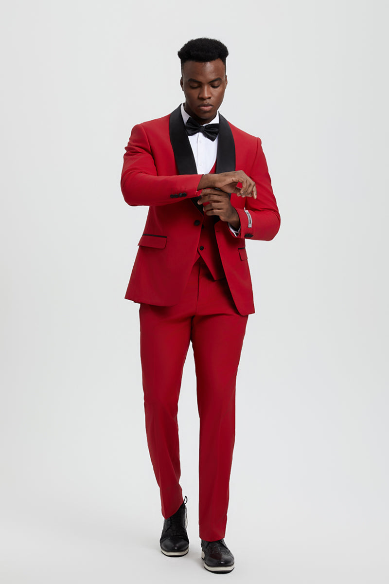Stacy Adams men's red tuxedo. Fitted blazer, single button, shawl lapel. Smooth red fabric with black accents. Matching tailored trousers create a streamlined silhouette.
