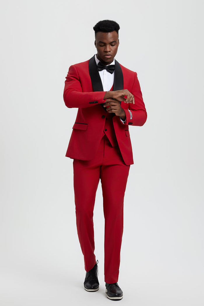 Stacy Adams men's red tuxedo. Fitted blazer, single button, shawl lapel. Smooth red fabric with black accents. Matching tailored trousers create a streamlined silhouette.
