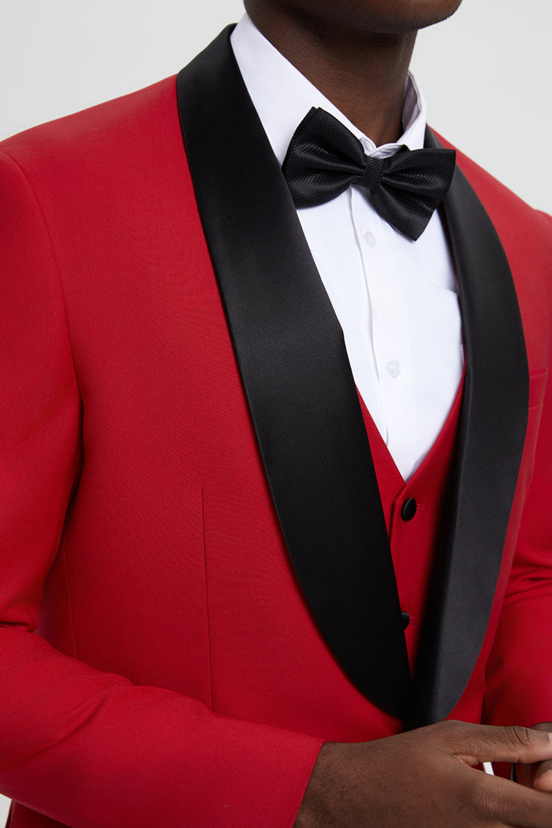 Red Stacy Adams one-button tuxedo with shawl lapel. Tailored silhouette, black satin collar, and matching vest. Features a white dress shirt. Smooth, structured fabric, formal design.
