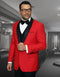Red wool tuxedo with black shawl lapel and pocket details. Structured fit, contrasting black buttons, smooth finish. Men's vested tuxedo.
