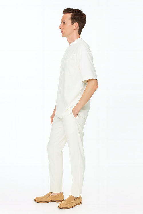 Men's linen two-piece set: short-sleeve shirt & pants. White, banded collar shirt, relaxed fit. Pants with straight cut. Patternless design.
